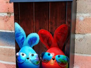 Colorful Easter Eggs in Sunglasses On Wooden Table Colonial Mailbox Cover